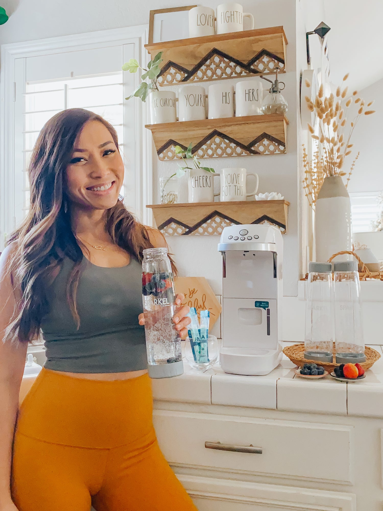 Fitness savvy person drinking healthy fruit infused sparkling soda water